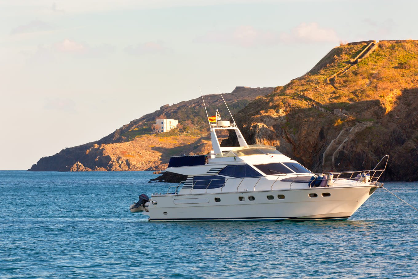 A white yacht at rest, reflecting the steady and dependable care Ozark Grease Pros provides for local businesses.
