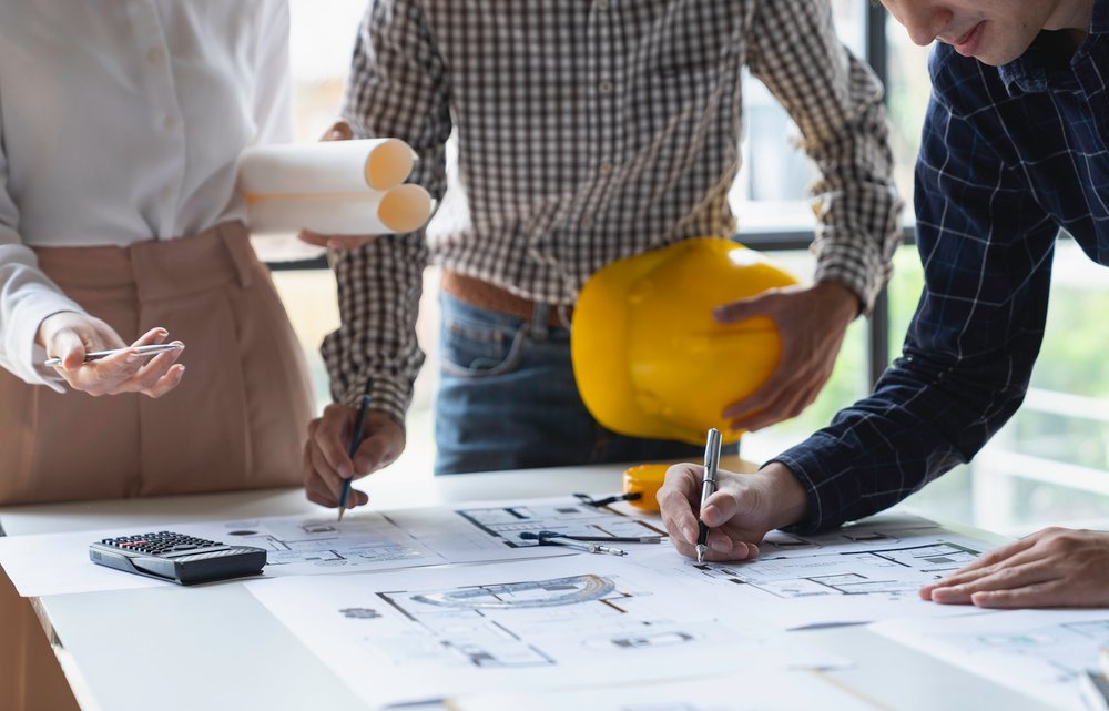 At Ozark Grease Pros, three people work together to plan a new grease disposal facility in Siloam Springs.